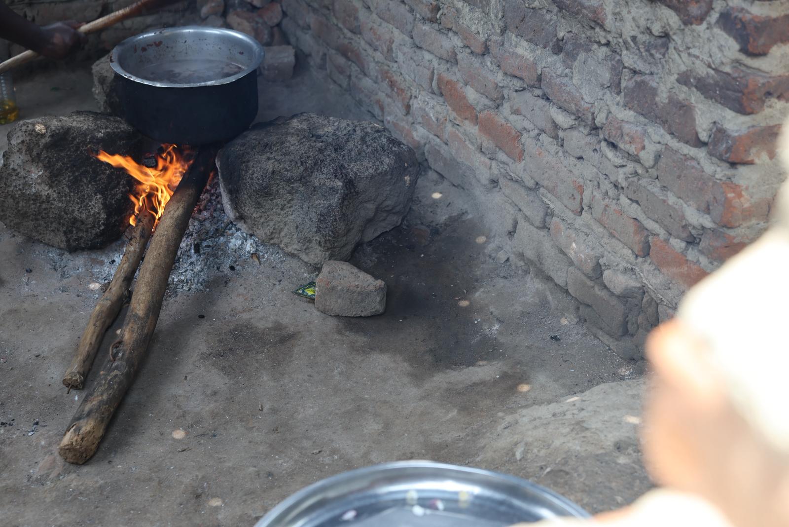 Traditional firewood cooking before Sandi AI